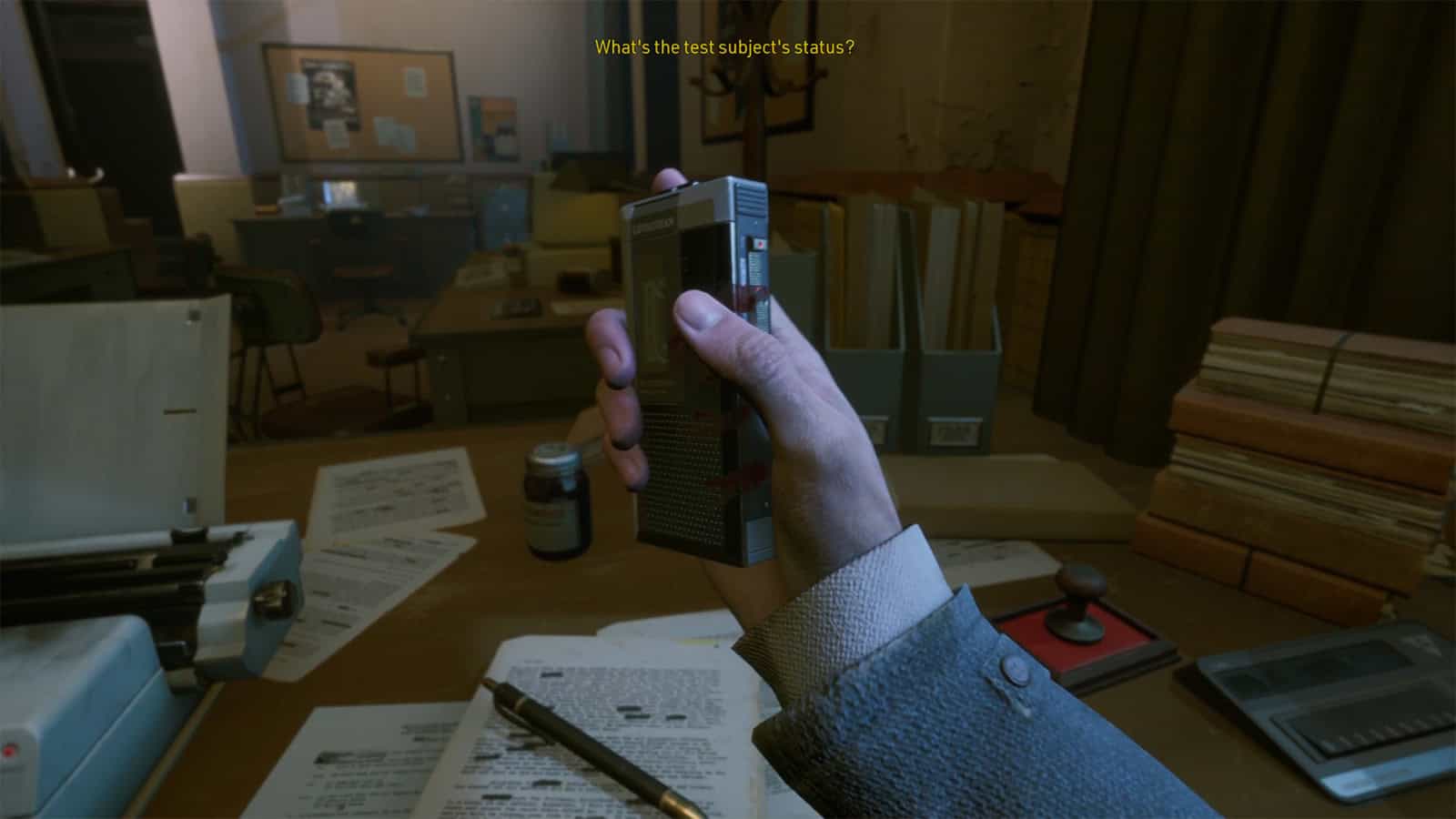 A screenshot of KARMA: The Dark World showing the playable character Shawn holding a bloodied tape recorder.