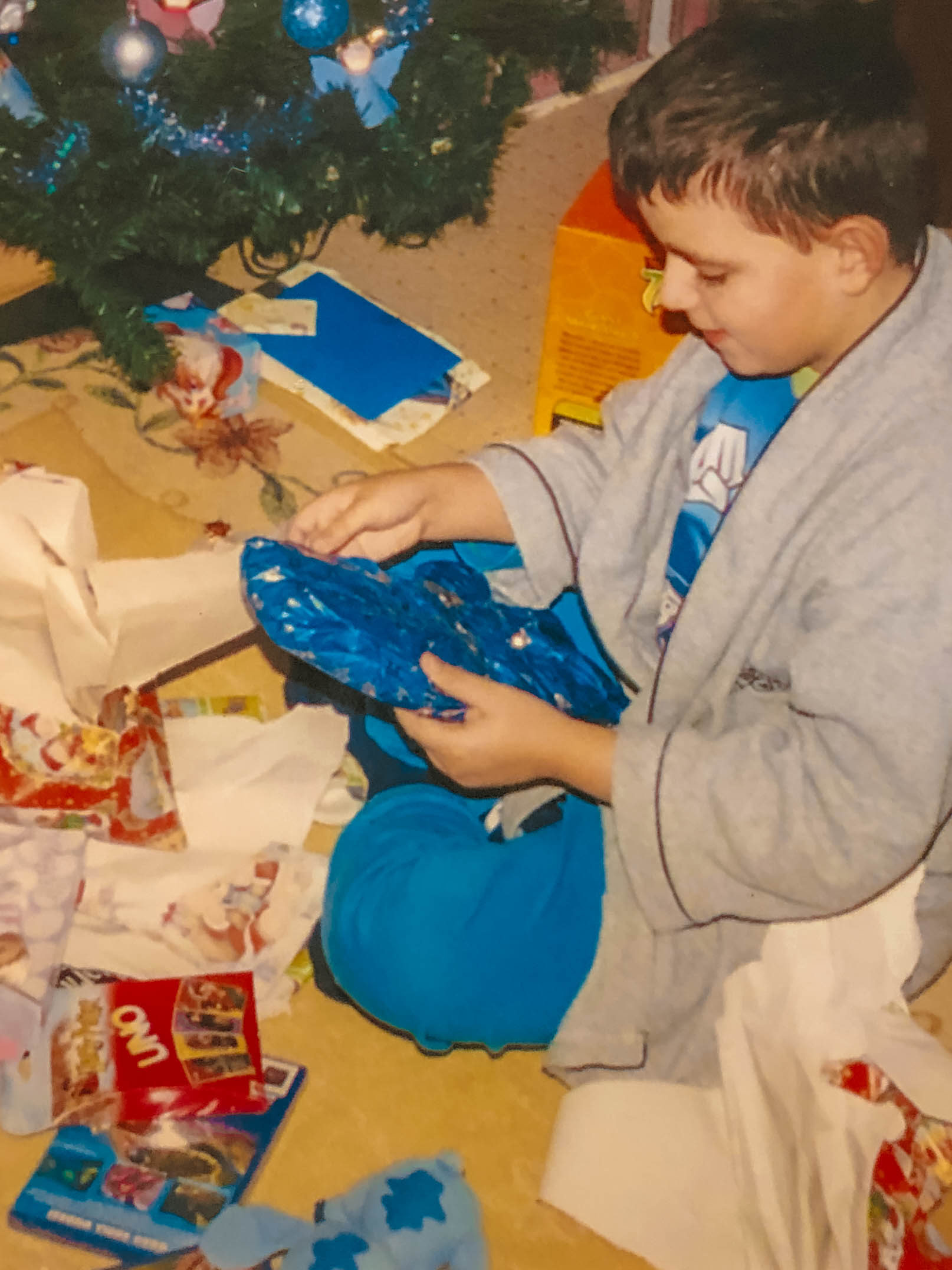 A family photo of Fabio Crispim on Christmas Day in 2003 after unwrapping the Finding Nemo PS2 video game, located bottom left.